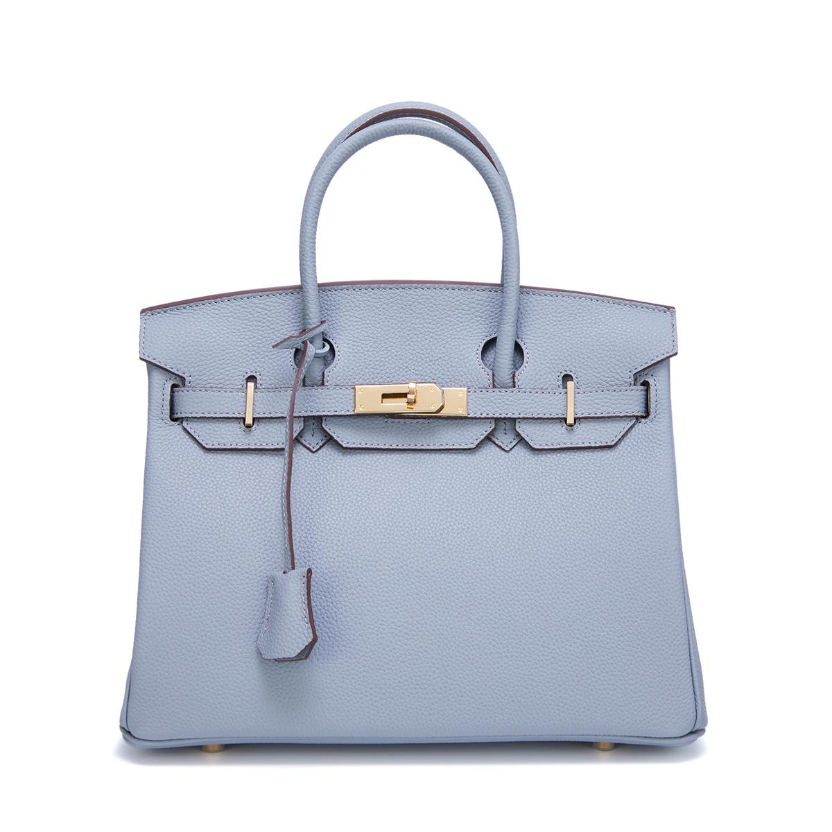 Neue Togo Small Grain Gold Buckle Platin Toe Cover Layer Rindsleder Damentasche Große Kapazität Handtasche Damentasche 25x10x19cm hellblaue