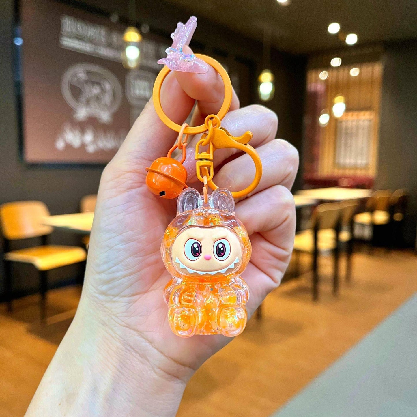 Labubu Plüschpuppe Handy-Anhänger: Niedlicher, farbenfroher, transparenter Rucksack-Anhänger-Schlüsselanhänger orange